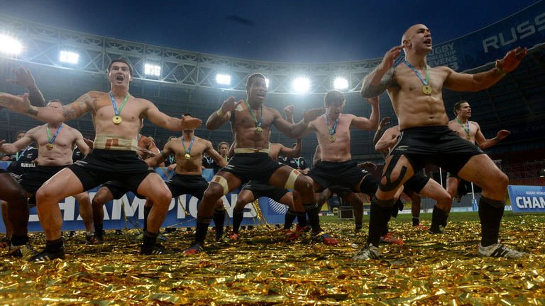 New Zealand's players dance and sing as they celebrate their victory over England in the Rugby World Cup Sevens 2013 final match in the Luzhniki Stadium in Moscow on June 30, 2013. New Zealand won 33-0.
