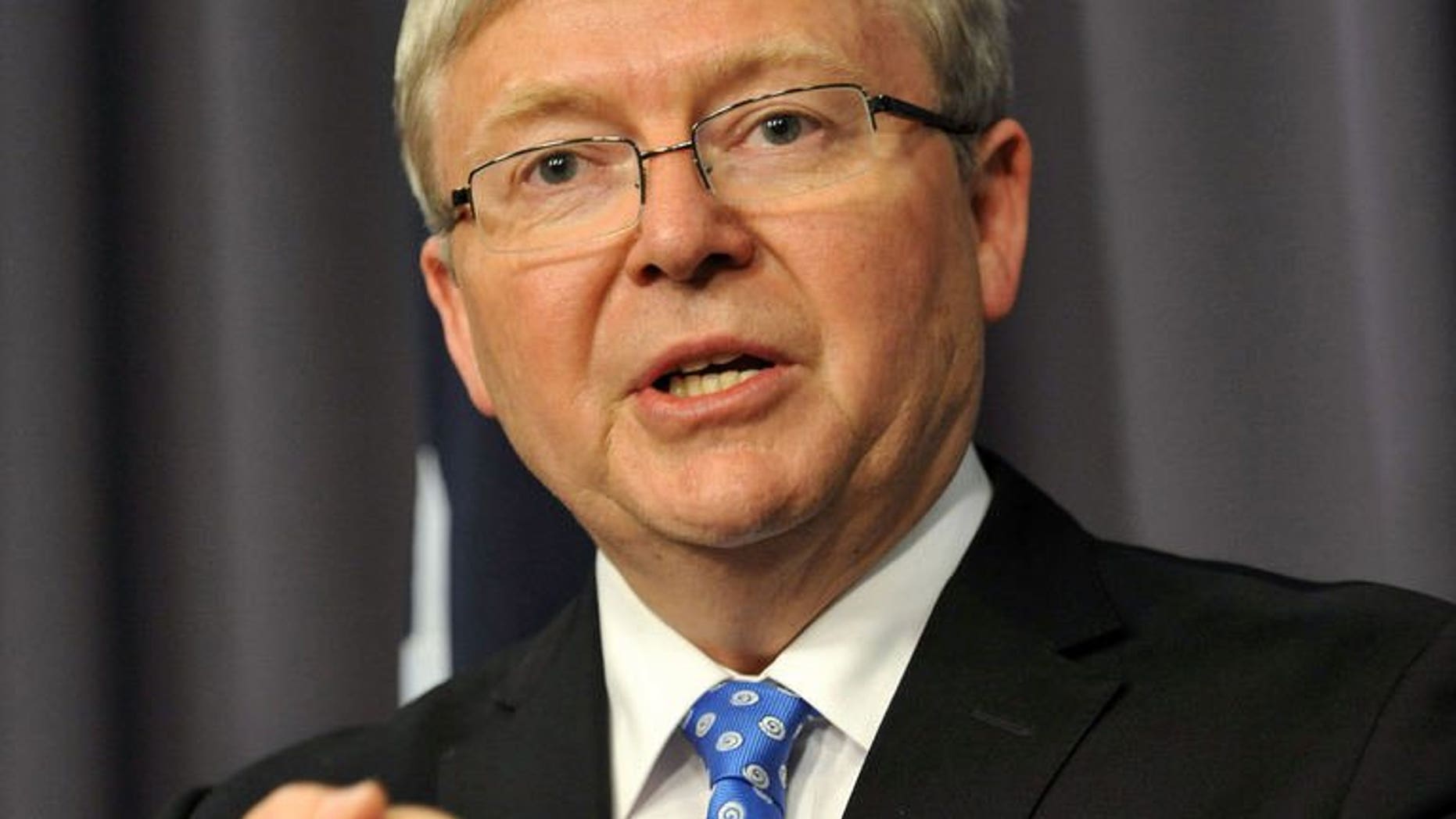 Former Australian Prime Minister Kevin Rudd talks to the media at Parliament House, Canberra on June 26, 2013. Rudd unveiled his cabinet on Monday, bringing in a record number of women and switching the focus to the economy.