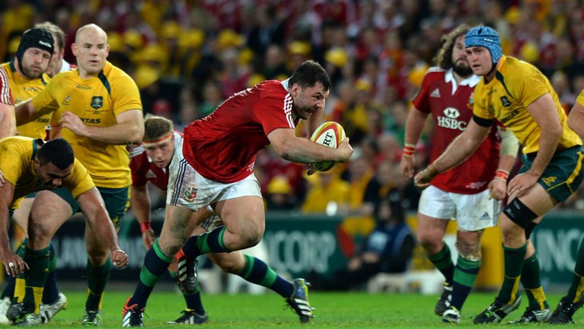 British and Irish Lions player Alex Corbisiero runs with the ball against Australia in Brisbane on June 22, 2013. Corbisiero was called up as a replacement loosehead prop and distinguished himself in the front row on his Lions Test debut in the Brisbane victory before a calf injury that ruled him out of the second Test.