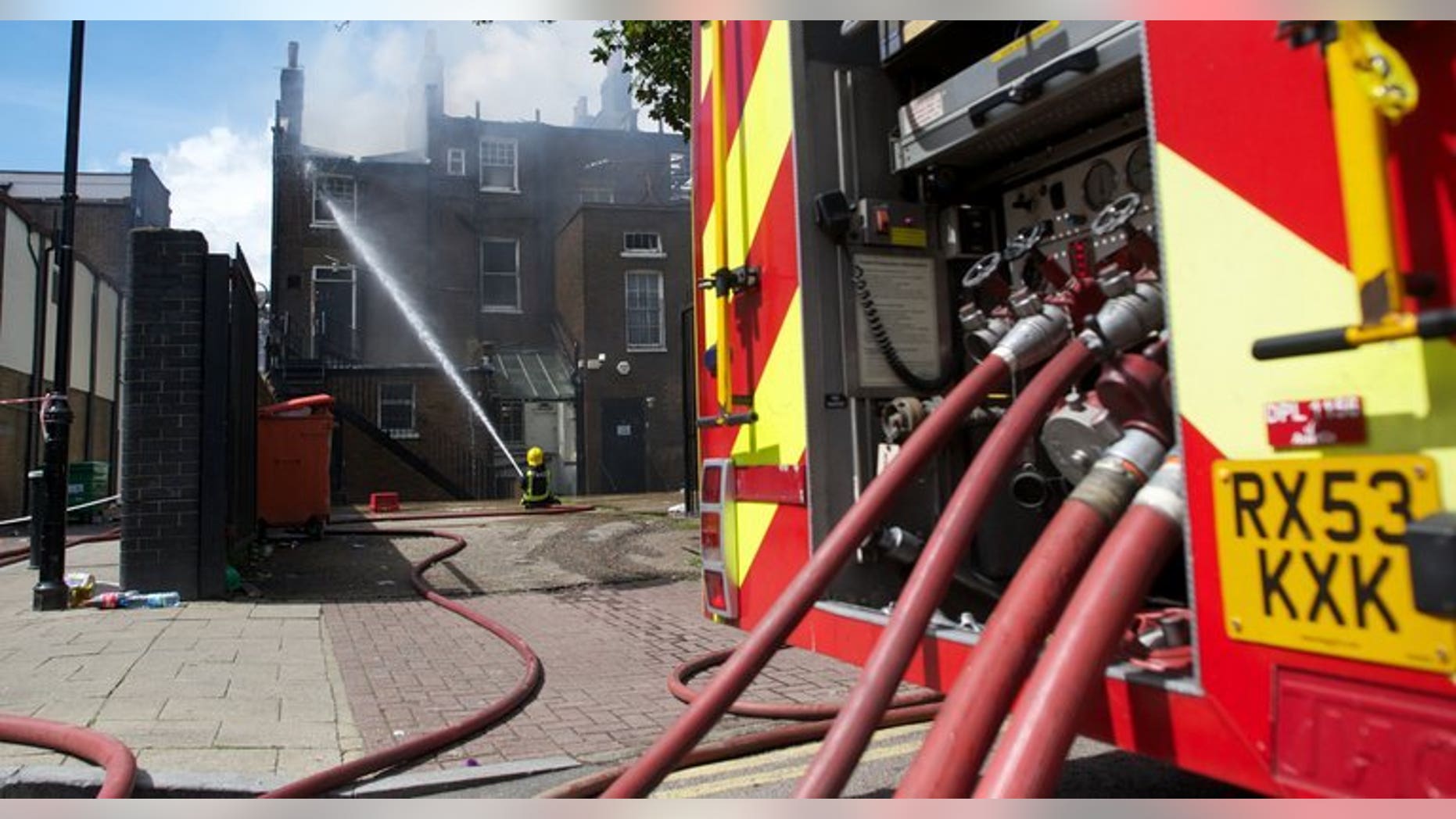 File picture shows firefighters trying to extingush a blaze in north London on August 7, 2011. More than 200 firefighters were on Monday battling a major blaze at a British recycling plant after 100,000 tonnes of paper and plastic caught fire, sending a plume of smoke rising into the sky which could be seen for miles around.