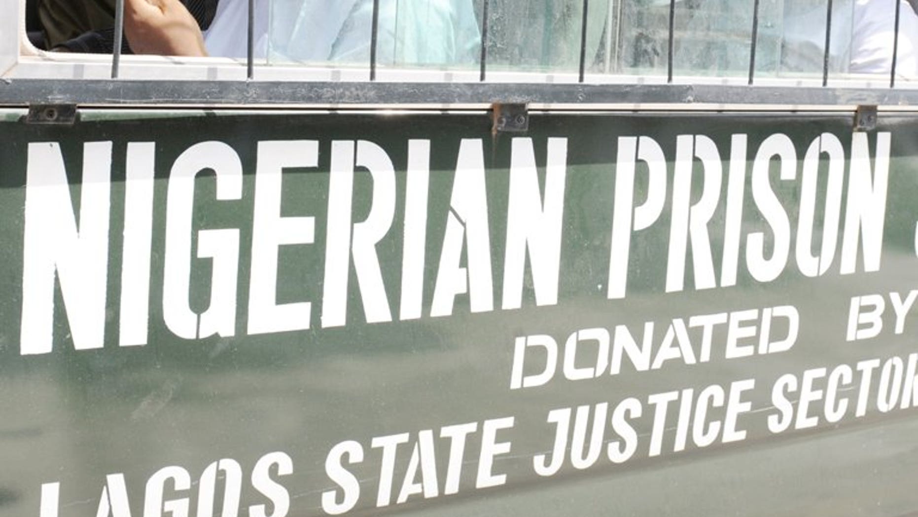 Prisoners sit on March 7, 2011 in a bus headed to prison from Lagos. Nigerian authorities have rearrested 49 of 175 prison inmates who escaped from their southwest city jailhouse after it was attacked by gunmen, a spokesman of the Nigerian Prisons Service said on Monday.