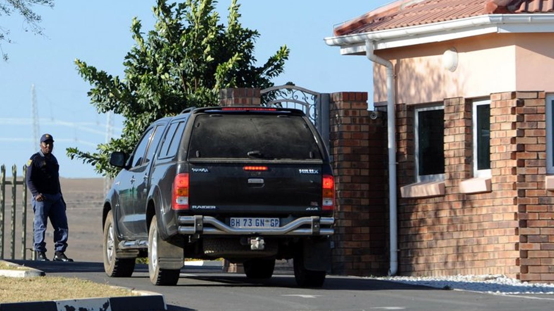 A car carrying elders from the Mandela family is seen outside the former state president's home in Qunu on June 25, 2013. Lawyers for Nelson Mandela's relatives met Monday to try to resolve a bitter family feud over the eventual burial site of the critically ill anti-apartheid hero.