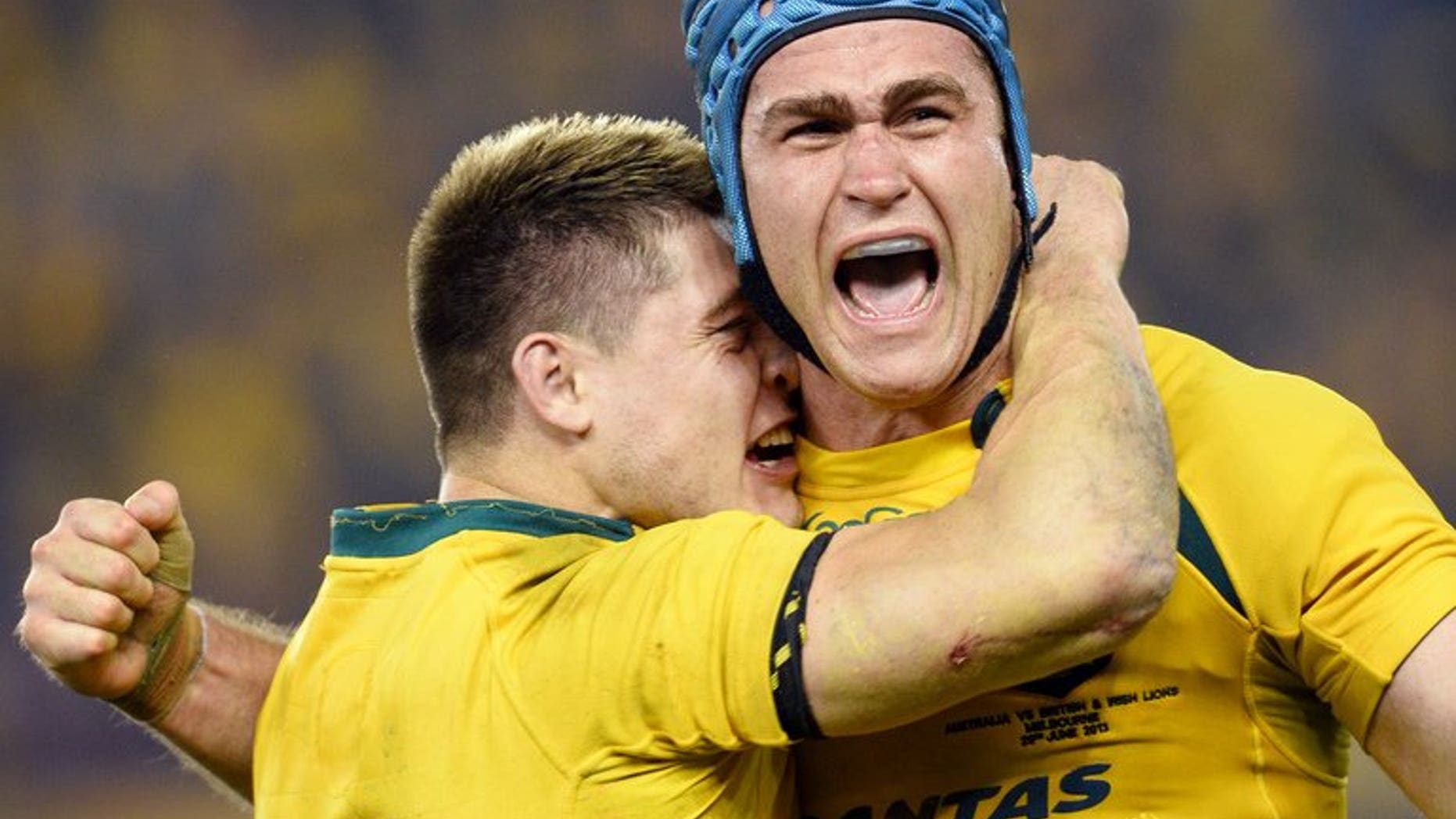 Australian captain James Horwill (R) and flyhalf James O'Connor celebrate victory over the British and Irish Lions on June 29, 2013 in the second Test. Horwill was cleared of stamping on Lions player Alun Wyn Jones in the first Test, meaning he can play in this weekend's series decider.