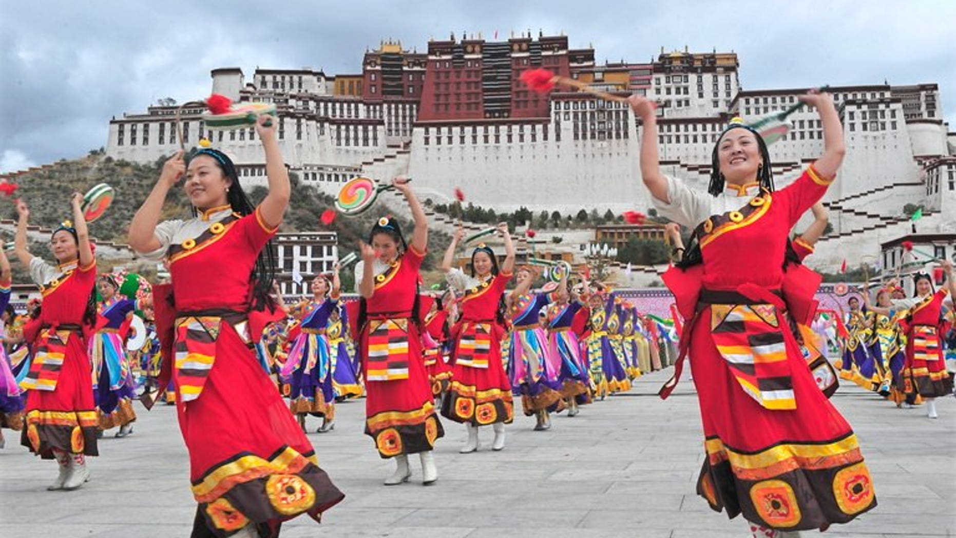Tibetan performers dressed in traditional costume perform in Lhasa on June 21, 2008. The controversial renovation of the historic area around a key monastery in the Tibetan capital has been completed, Chinese state media said.