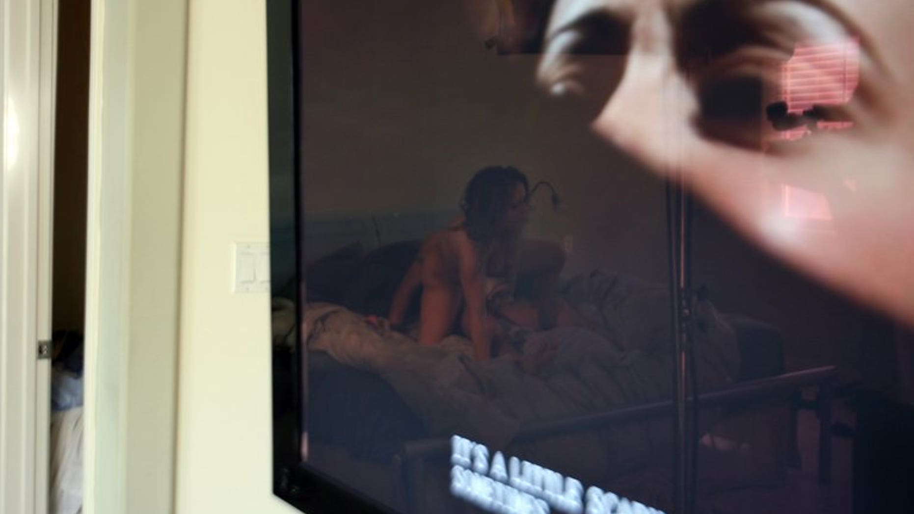 Photo illustration. A maintenance worker surprised passers-by near a Chinese railway station when he started watching a banned porn film, not realising his computer was connected to a giant screen, state media said.