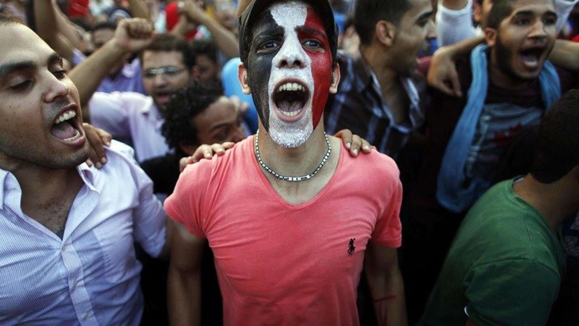 Egyptians shout slogans against President Mohamed Morsi and the Muslim Brotherhood during a demonstration in Cairo, on July 1, 2013. Egypt's main opposition coalition says it would not support a "military coup" and trusted that an army statement giving political leaders 48 hours to resolve the current crisis did not mean it would assume a political role.