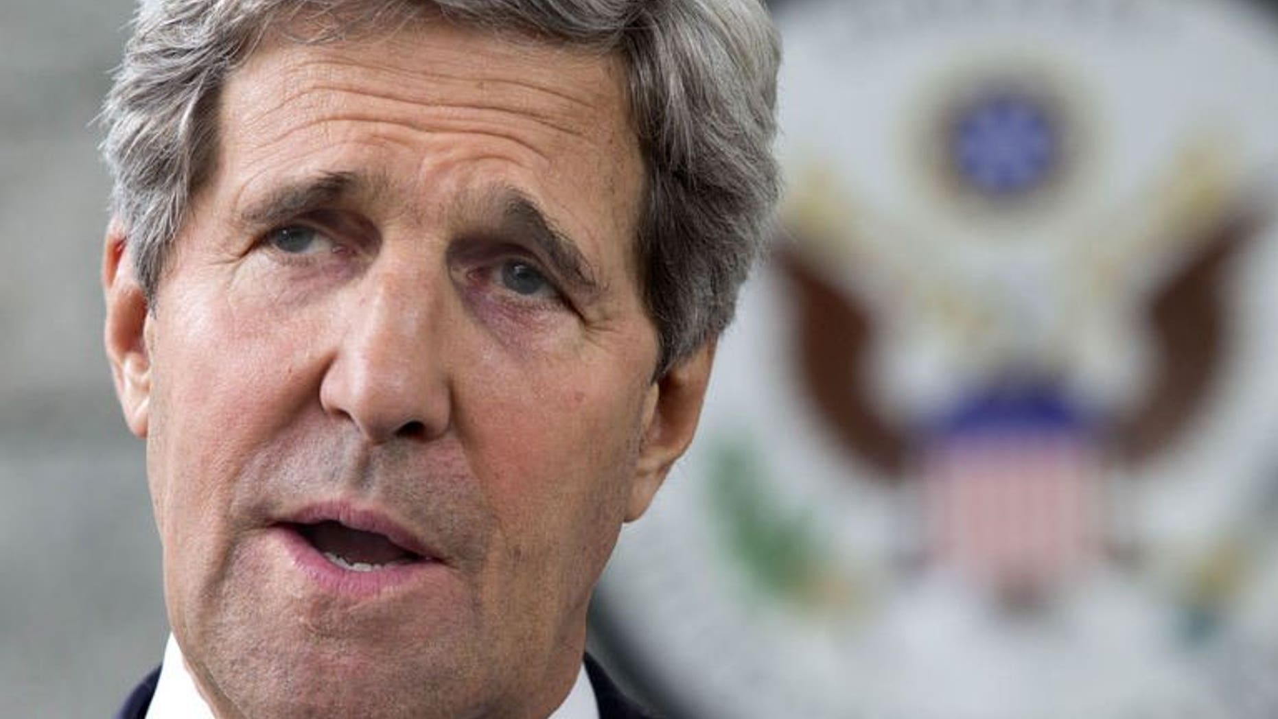 US Secretary of State John Kerry makes a statement to the press regarding his meeting with Russian Foreign Minister Sergey Lavrov in Bandar Seri Begawan, Brunei, on July 2, 2013. Kerry said the United States and Russia were committed to holding a peace conference on Syria but that it would likely take place after August.