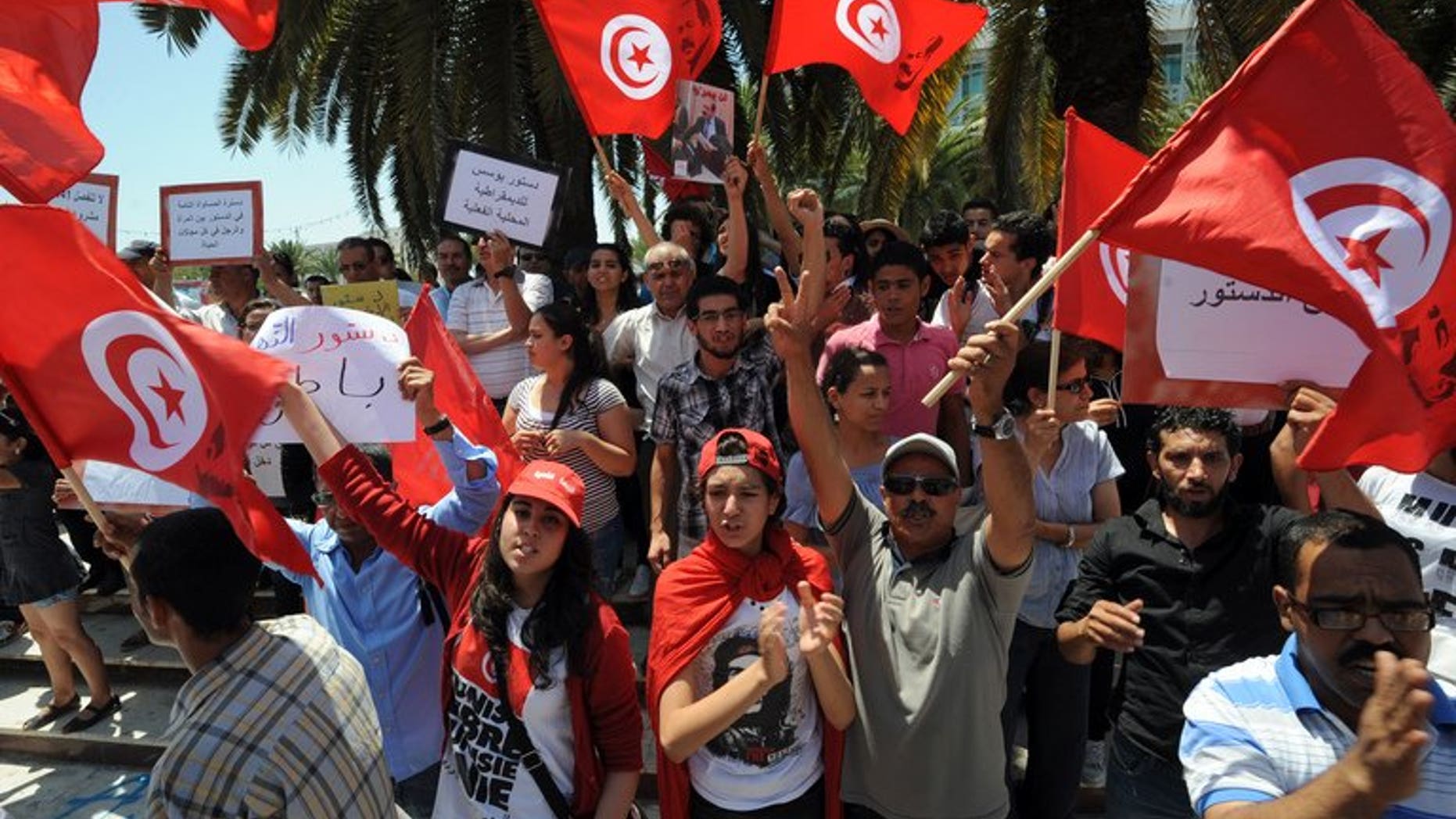 Tunisians shout slogans against the ruling Ennahda Party during a protest in front of the Constituent Assembly on July 1, 2013 in Tunis. Troubled French automaker PSA Peugeot Citroen on Tuesday opened a new plant in central China, vowing to raise its share of the world's biggest car market.