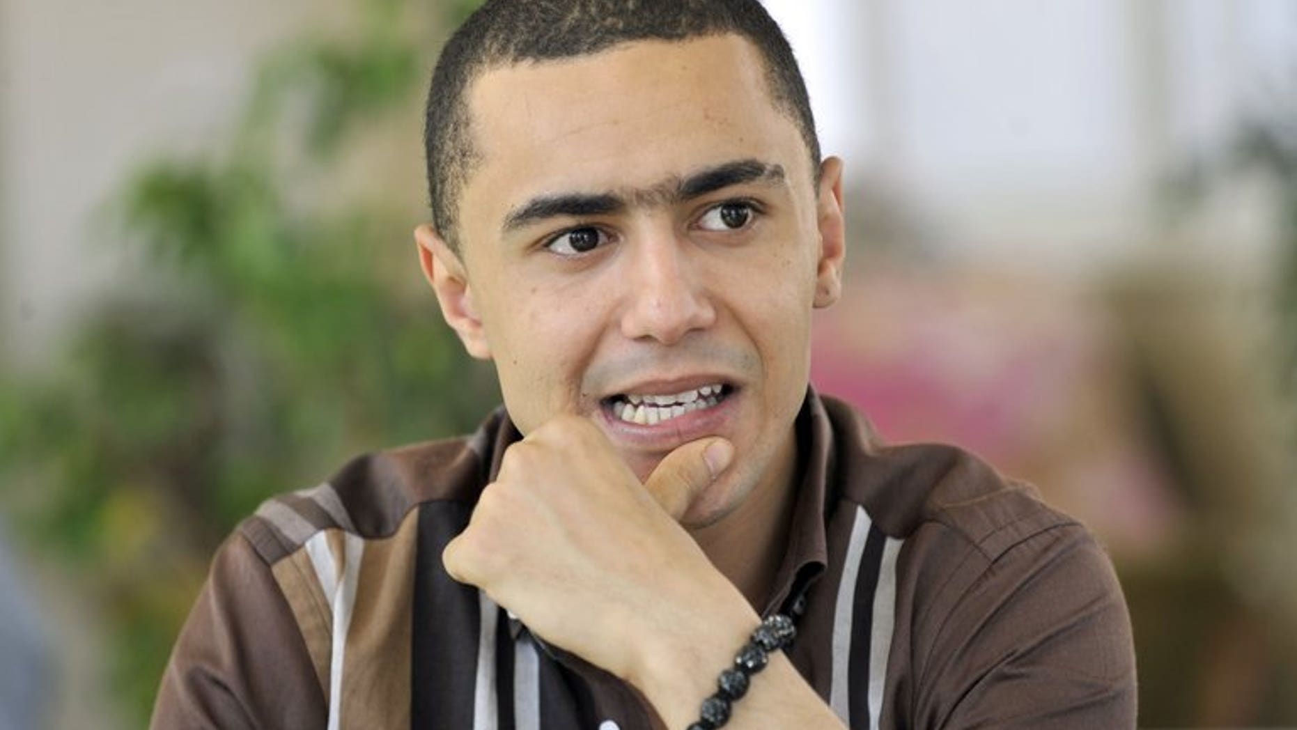 Tunisian rapper Ala Yaacoubi, or "Weld El 15???, arrives for his trial at a court in Tunis on June 13, 2013. Yaacoubi, jailed for two years last month for a song in which he insulted the police, will be freed on Tuesday after being given a six month suspended sentence on appeal, his lawyer says.