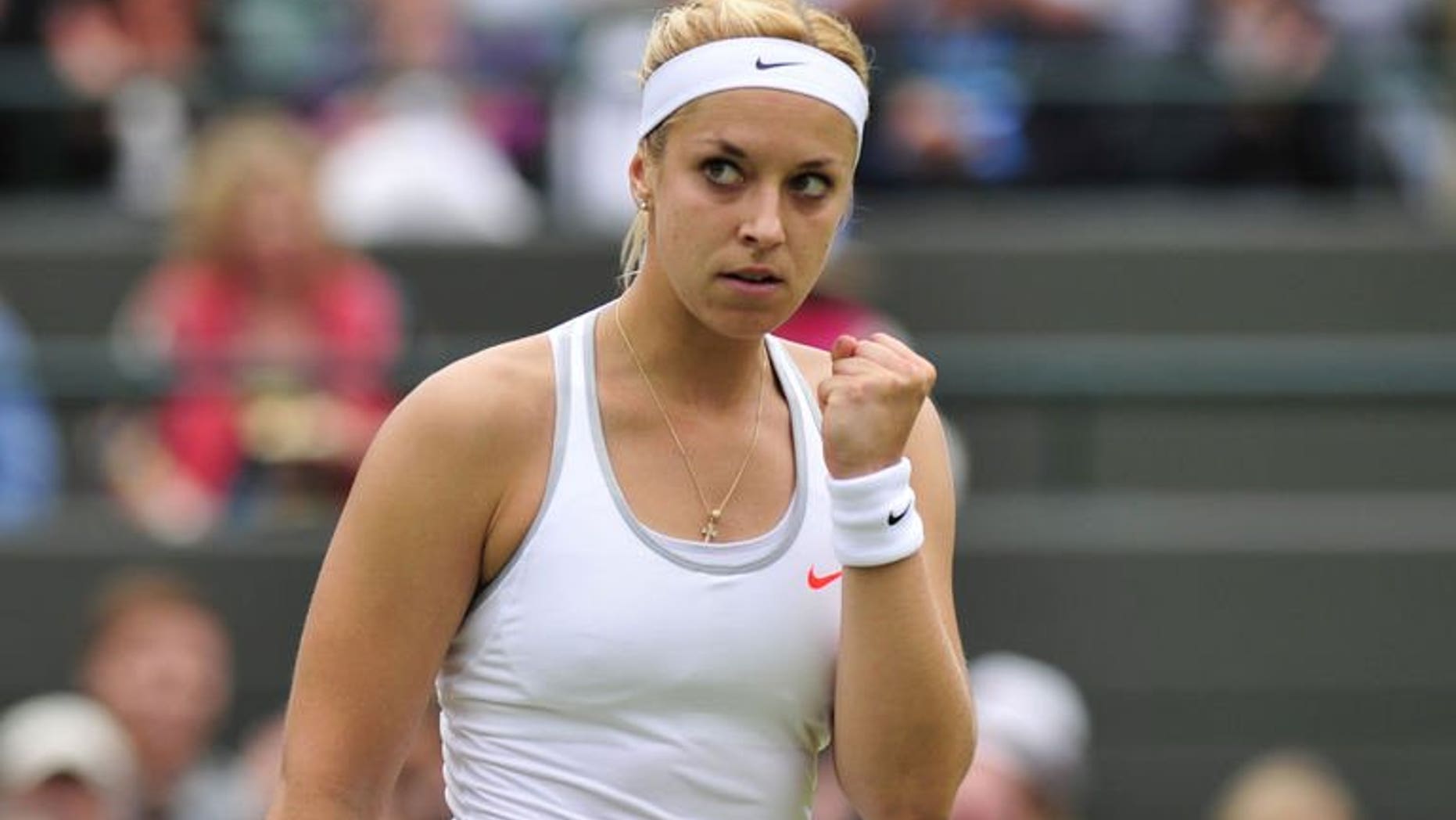 Germany's Sabine Lisicki celebrates taking a point against Estonia's Kaia Kanepi during their women's quarter-final match at the Wimbledon Championships in southwest London, on July 2, 2013. Lisicki swept into the Wimbledon semi-finals with an emphatic 6-3, 6-3 victory over Estonia's Kaia Kanepi.