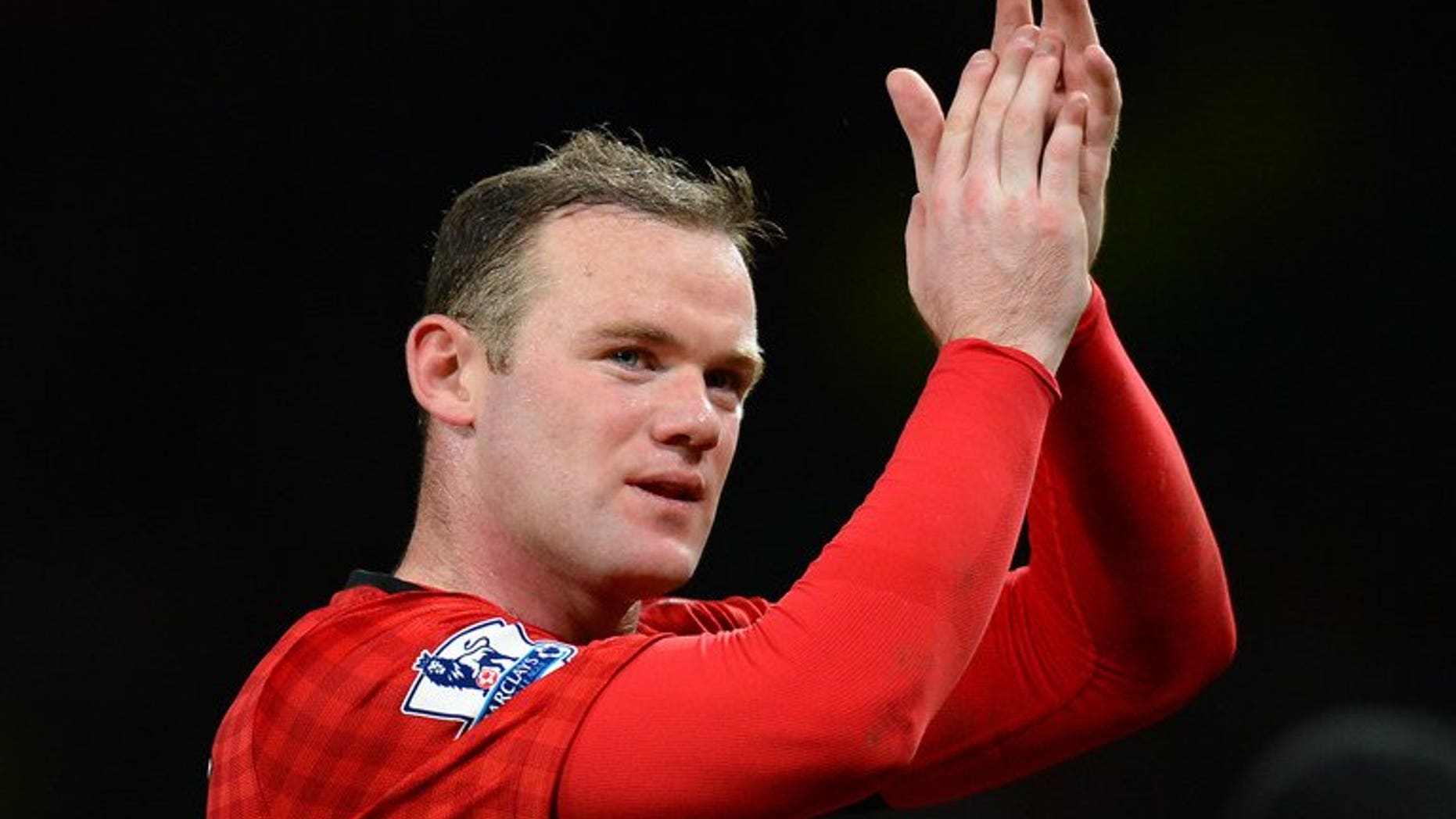 Manchester United's Wayne Rooney acknowledges the crowd after the final whistle in the league match against Everton at Old Trafford, on February 10, 2013. Rooney may wish to leave the Premier League champions in order to seek a "fresh challenge" elsewhere, according to former assistant coach Mike Phelan.