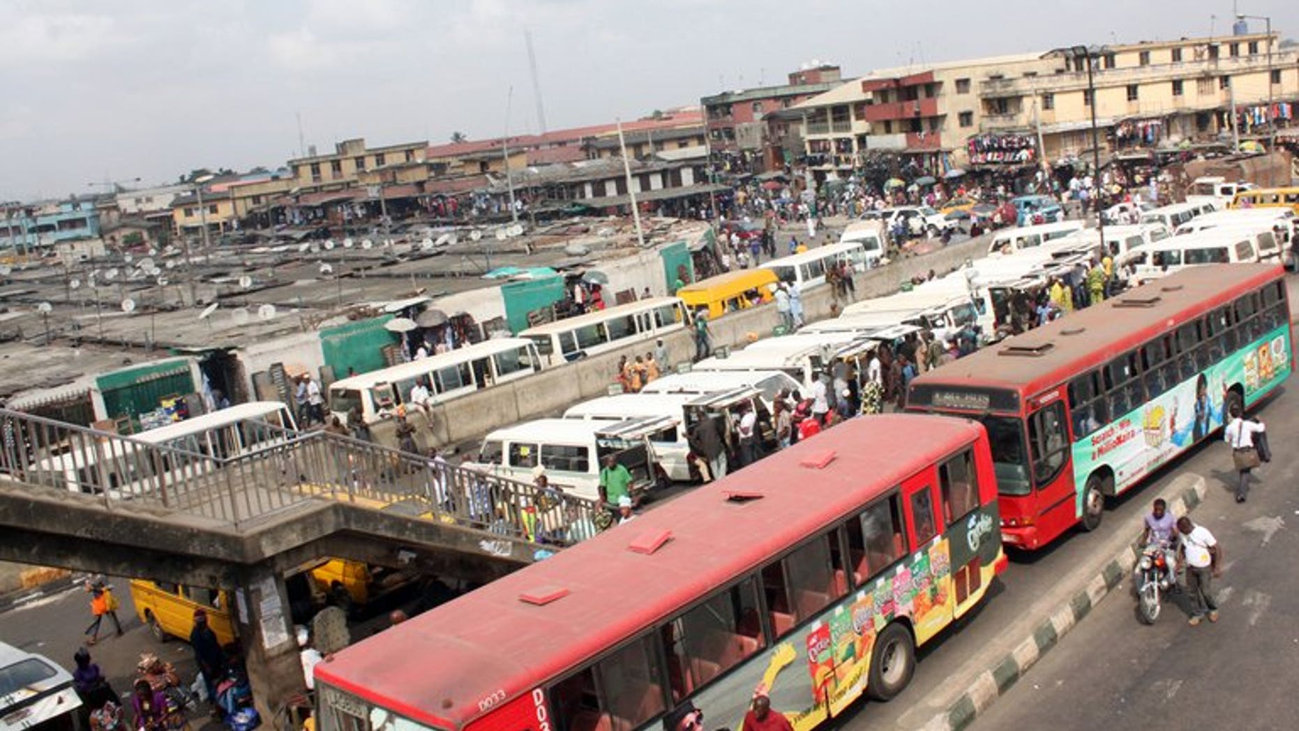 Buses are seen near a market in Lagos on February 1, 2012. Long queues have formed at petrol stations in some Nigerian cities after a key oil workers union ordered a three-day strike to demand better conditions and road repairs.