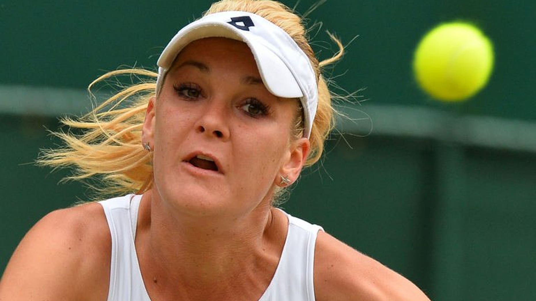 Poland's Agnieszka Radwanska eyes a return against China's Li Na during their quarter-final match at the Wimbledon Championships in southwest London, on July 2, 2013. Radwanska won 7-6 (7/5), 4-6, 6-2 in a two-hour, 43 minute contest on Centre Court.