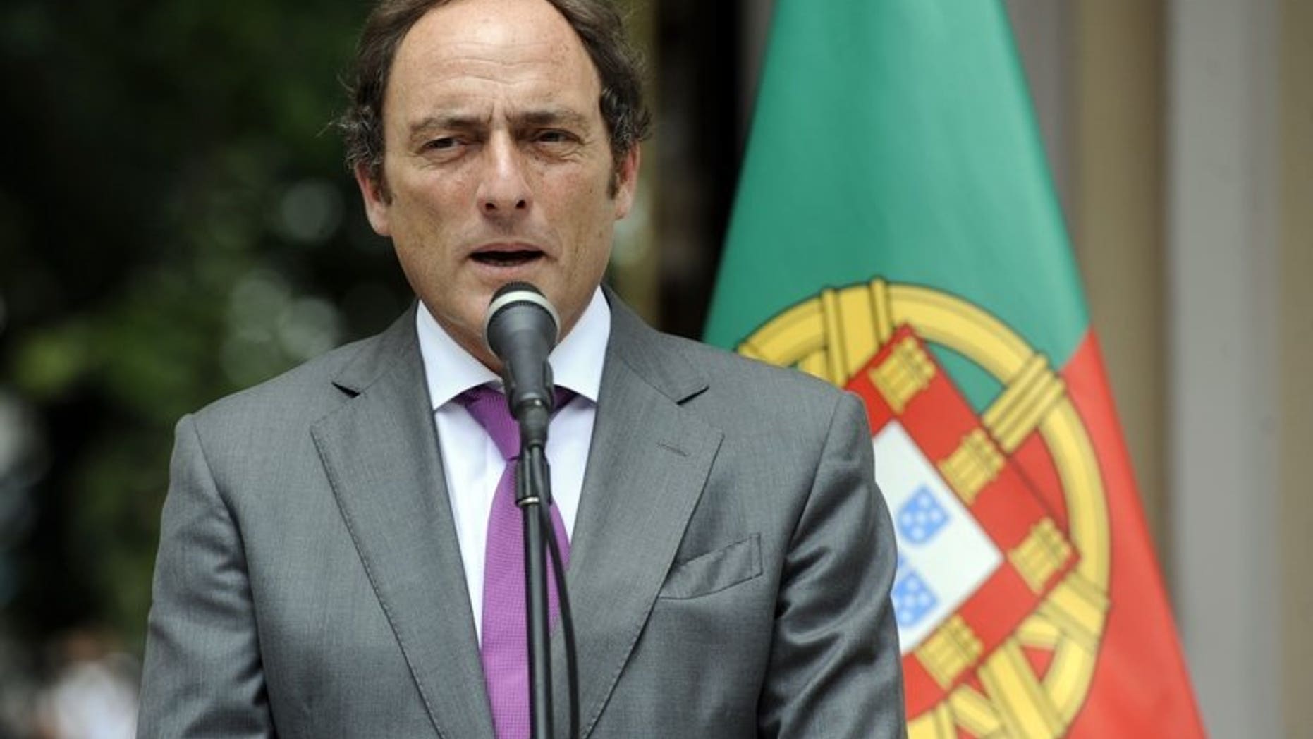 Portugal's then-foreign minister Paulo Portas gives a press conference in Caracas on May 20, 2013. Portas tendered his resignation on Tuesday, a day after the country's finance minister also quit.