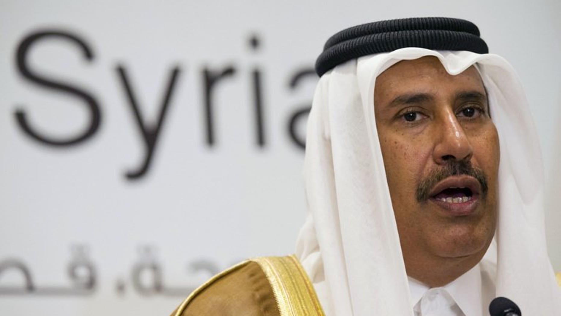 Qatari former prime minister and foreign minister Hamad bin Jassim al-Thani, speaks at a news conference on June 22, 2013. The former prime minister and strongman was Tuesday replaced as deputy head of the powerful Qatar Investment Authority in a shakeup ordered by the country's new young emir, official QNA news agency reported.