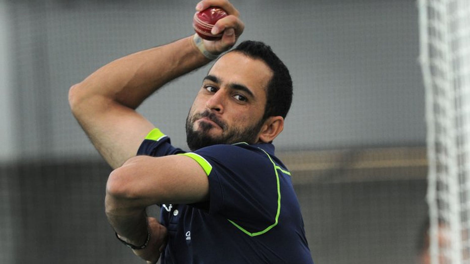 Legspinner Fawad Ahmed bowls at the indoor cricket nets at the MCG in Melbourne on June 6, 2013. England great Graham Gooch expressed surprise Tuesday that Australia were prepared to pick Ahmed