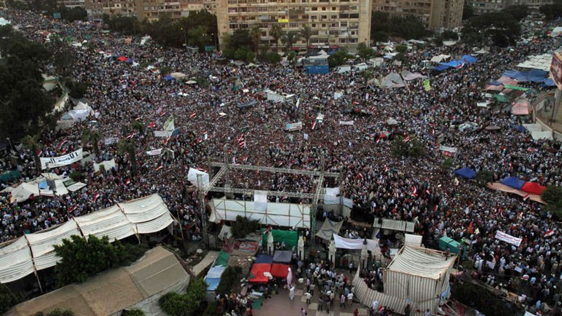 Egyptian supporters of President Mohamed Morsi gather in Rabaa el-Aadawia district of cairo on July 2, 2013. Britain warned its nationals against all but essential travel to most of Egypt after the army threatened to intervene to quell ongoing protests against President Mohamed Morsi.
