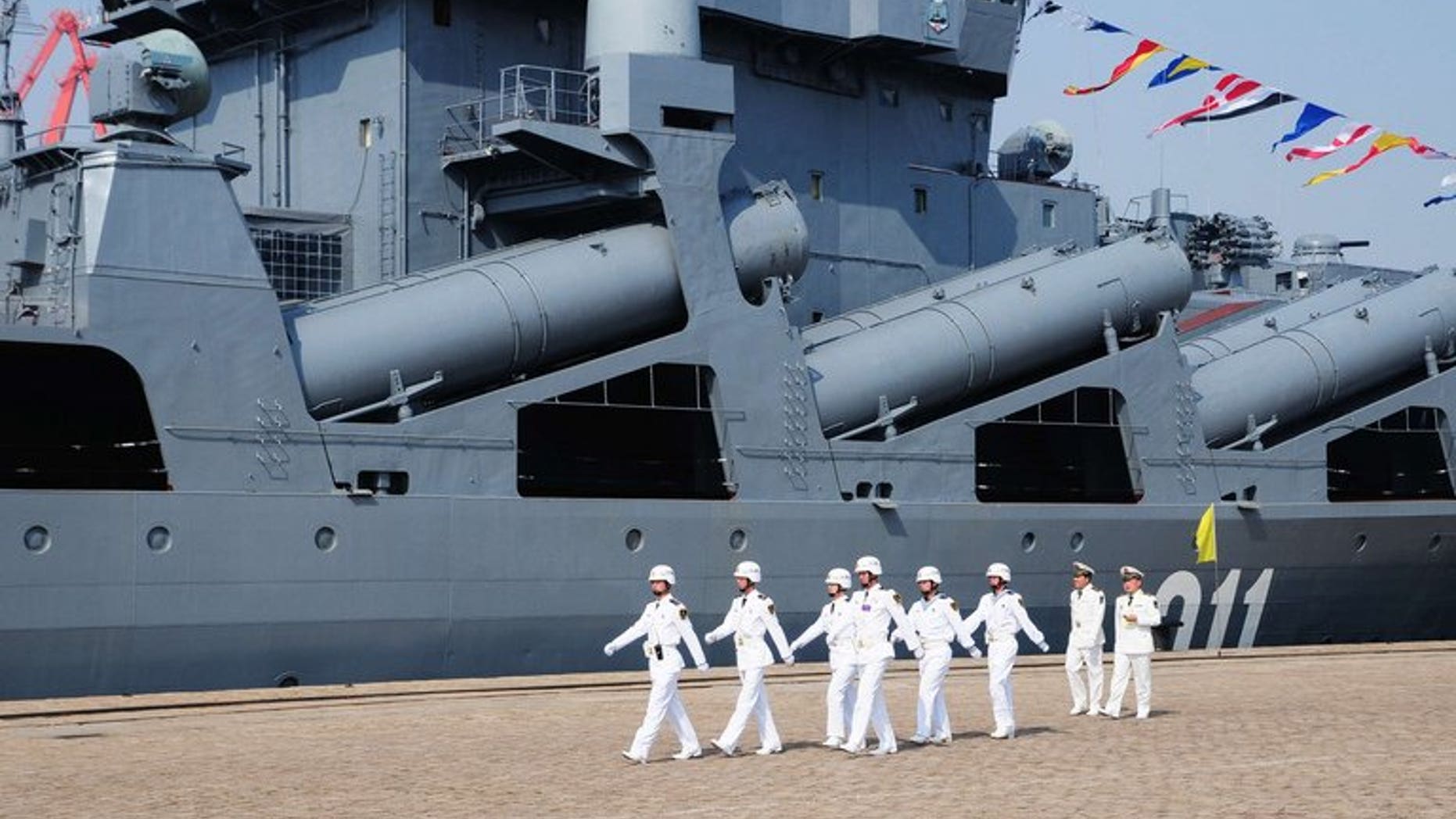 Chinese sailors march past the Russian destroyer Admiral Vinogradov, in Qingdao, northeastern China, on April 23, 2012. China and Russia will hold their second joint naval exercises from Friday, state media said, as Beijing and Tokyo row over disputed islands in the East China Sea.