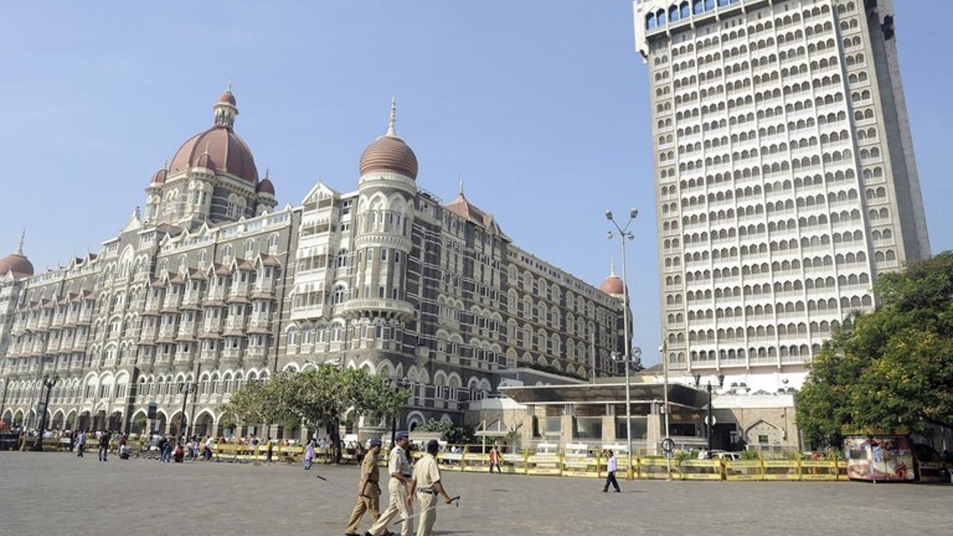 Indian policemen patrol in Mumbai on November 26, 2011. Indian investigators seized more than 100 bags stuffed with cash, gold and diamond jewellery during a raid on four trucks in Mumbai, marking one of the city's largest such hauls, reports and officials said Wednesday.