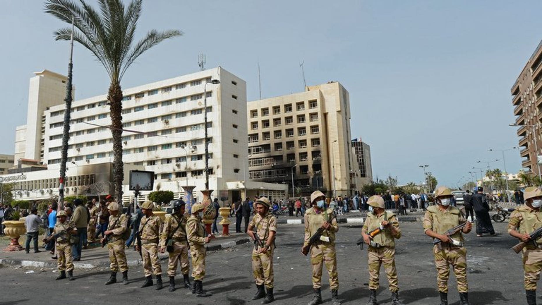 Egyptian soldiers stand guard in front of the Port Said security headquarters on March 8, 2013. Senior military commanders were in emergency talks on Wednesday after Egypt's embattled President Mohamed Morsi rejected their ultimatum to resolve the current crisis, a source close to the military told AFP.
