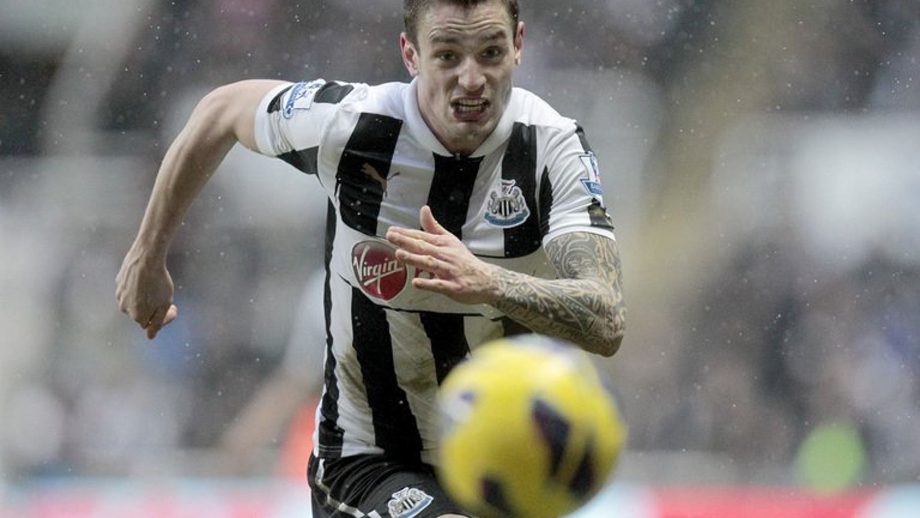 Newcastle United's Mathieu Debuchy chases down the ball during a league match against Reading at St James Park, on January 19, 2013. Debuchy has played down media speculation linking him with big-spending Ligue 1 giants Paris Saint-Germain and Monaco by declaring that he is happy in England.