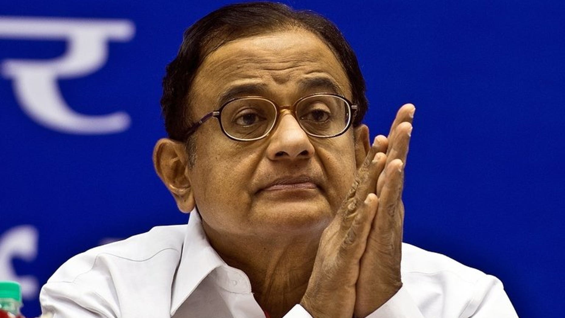 Indian Finance Minister P. Chidambaram attends a press conference in New Delhi, on June 5, 2013. Chidambaram said India's state-run banks will open 10,000 branches this year as part of a drive to extend formal financial services to the estimated 40 percent of the country without them.