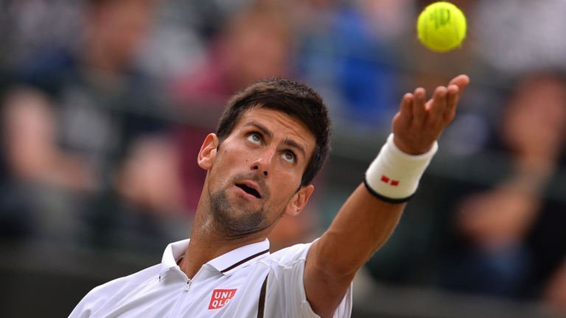 Serbia's Novak Djokovic serves against Czech Republic's Tomas Berdych during their quarter-final match at the Wimbledon Championships in southwest London, on July 3, 2013. Djokovic reached his 13th consecutive Grand Slam semi-final with a 7-6 (7/5), 6-4, 6-3 win over Berdych.