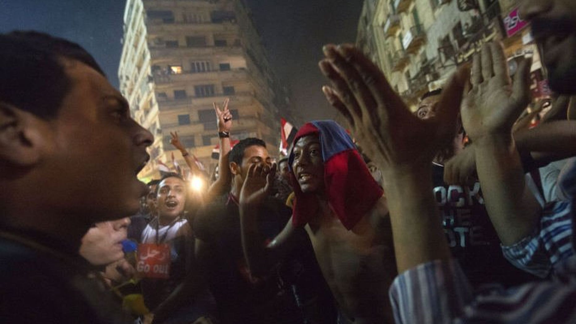 People celebrate at Tahrir Square after the announcement that President Mohamed Morsi was being toppled, on July 3, 2013 in Cairo. Egypt's new caretaker president Adly Mansour had been head of the Supreme Constitutional Court for just two days when the army named him leader of the Arab world's most populous state.