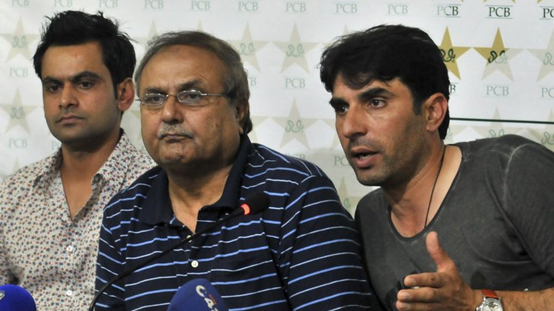 Pakistan ODI captain Misbah-ul Haq (right) sits with chief selector Iqbal Qasim (centre) and Twenty20 skipper Mohammad Hafeez as he speaks during a news conference in Lahore on July 3, 2013. Qasim has asked to step down at the end of his tenure, he said, denying any rift with the national team's captain and coach.