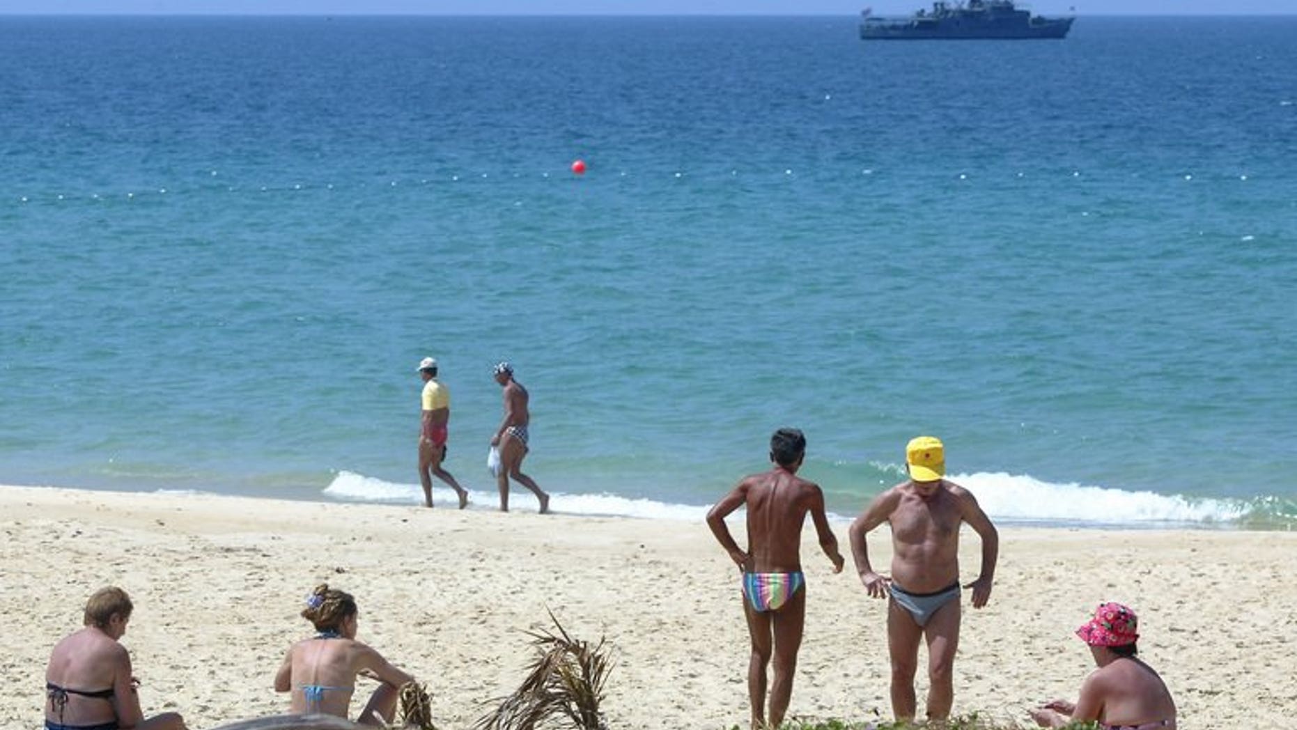 A Thai Navy vessel patrols the clear waters of the Andaman Sea near Phuket in southern Thailand, on January 29, 2005. Eleven crew members from a Bangladeshi cargo ship are missing after their vessel capsized in the Andaman Sea, sparking a rescue mission, Thai officials have told AFP.