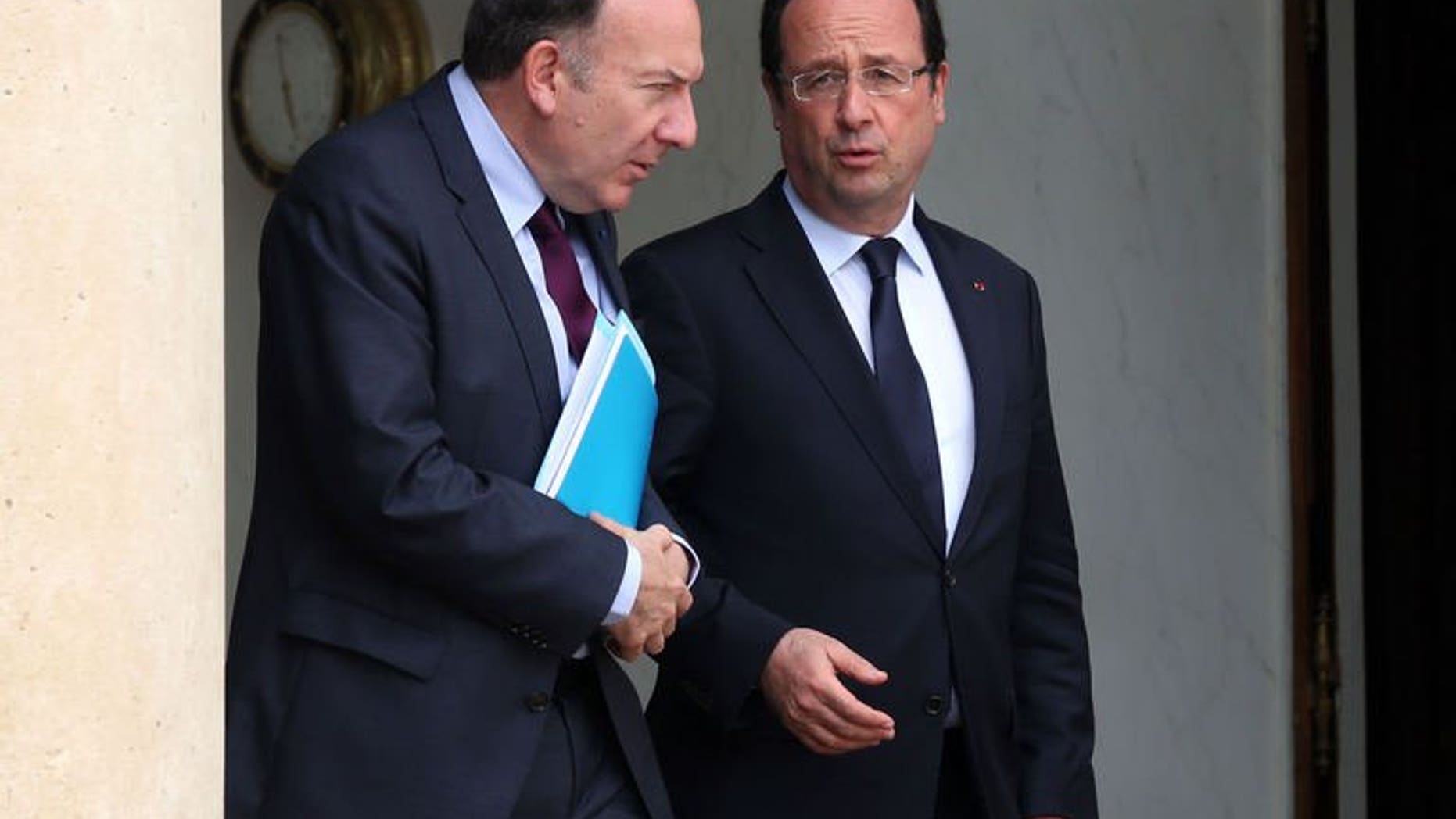New French employers' association chief Pierre Gattaz (left) talks with French President Francois Hollande as they leave the Elysee presidential palace in Paris, on July 4, 2013. Hollande has arrived in Tunisia, birthplace of the Arab Spring uprisings that is battling political instability and ruled by an Islamist-led government, for talks expected to be dominated by events rocking Egypt.