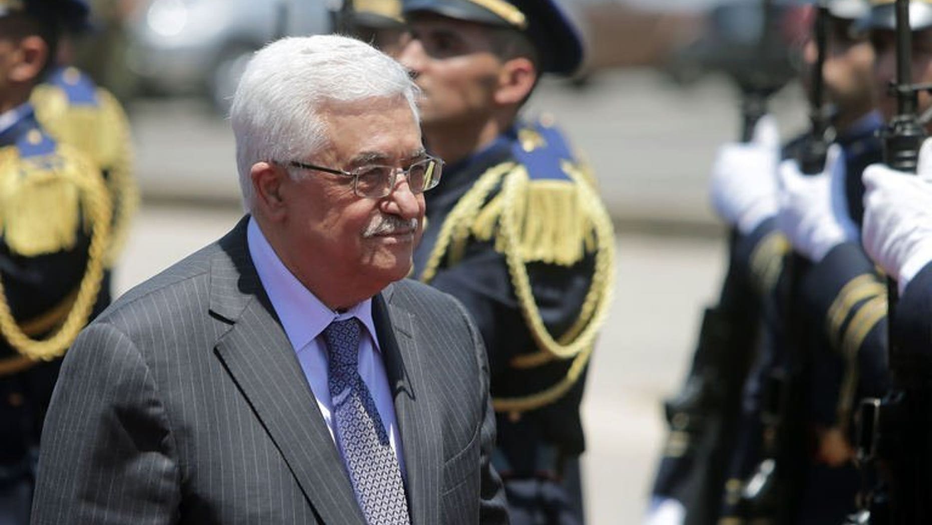 Palestinian president Mahmud Abbas reviews the guard of honour as he arrives in Beirut, on July 4, 2013. Abbas has congratulated Adly Mansour on his appointment as Egypt's interim president a day after Mohamed Morsi was overthrown by the Egyptian army.