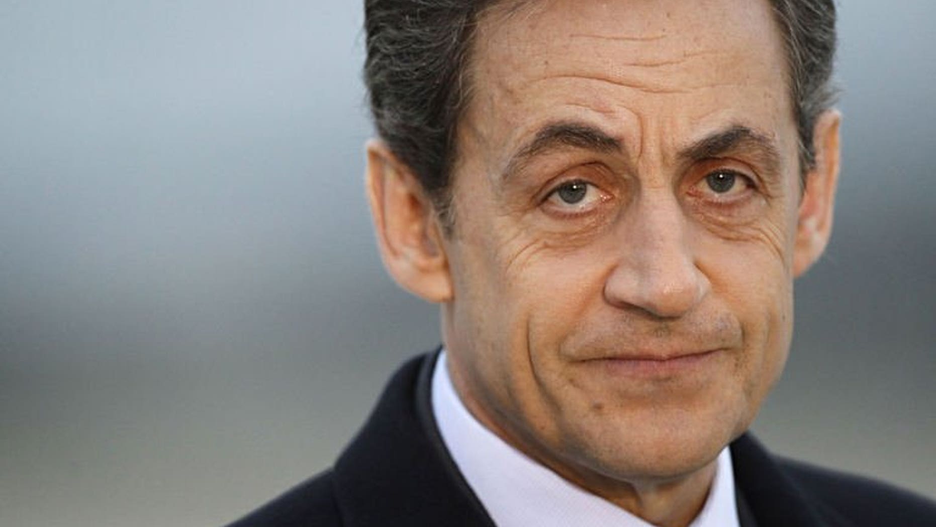 A photo taken on March 2, 2012 shows France's President Nicolas Sarkozy at the military airport of Villacoublay outside Paris. Sarkozy on Thursday resigned from France's top constitutional body after it upheld a decision that he had exceeded official spending limits during last year's election campaign.