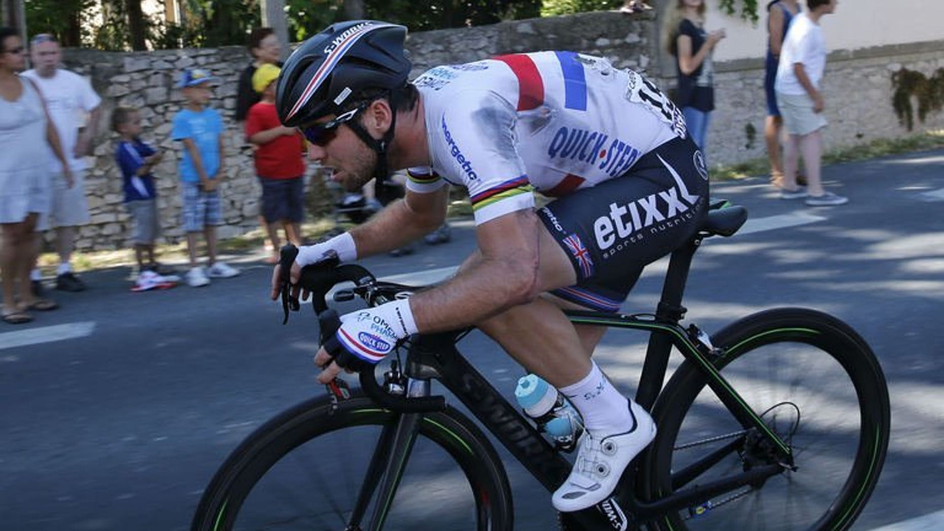 Britain's Mark Cavendish rides after a fall during the 176.5 km sixth stage of the Tour de France on July 4, 2013 between Aix-en-Provence and Montpellier, southern France. The British champion was fourth in the sprint for the line at the end of the 176-kilometre ride.