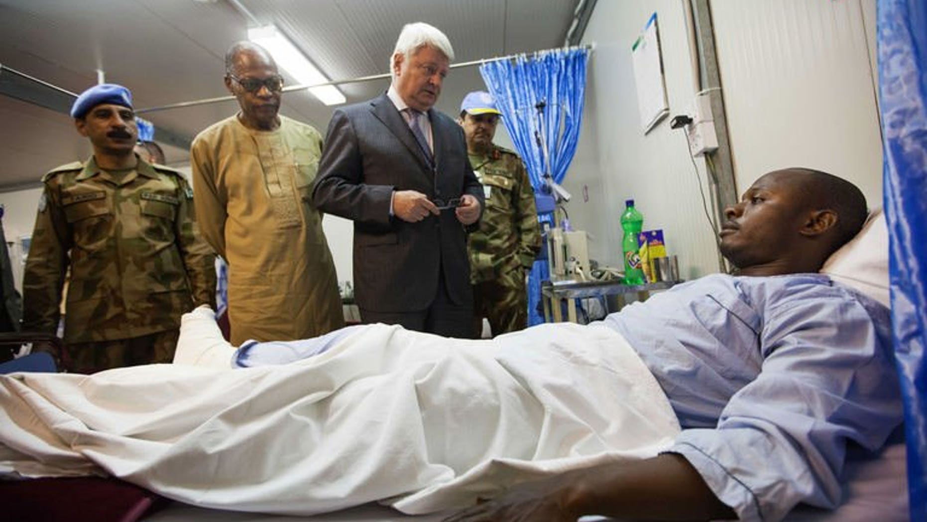 A picture released by UNAMID shows an injured UNAMID peacekeeper attacked in an ambush near Labado, East Darfur, on July 4, 2013. Attackers shot up an ambulance and wounded three Blue Helmets during an ambush in Sudan's Darfur region, the UN's peacekeeping chief said on Thursday.