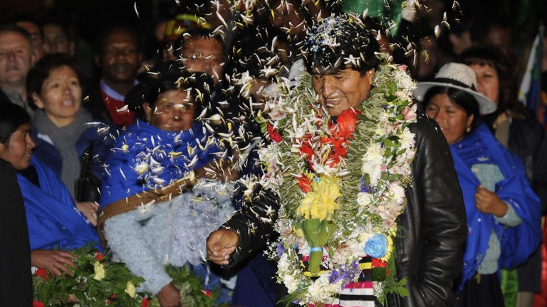 Bolivian President Evo Morales is greeted upon arrival at El Alto Airport late on July 3, 2013 in La Paz. Leftist Latin American leaders gathered in Bolivia on Thursday to back Morales, fuming after some European nations temporarily refused his plane access to their airspace amid suspicions US fugitive Edward Snowden was aboard.