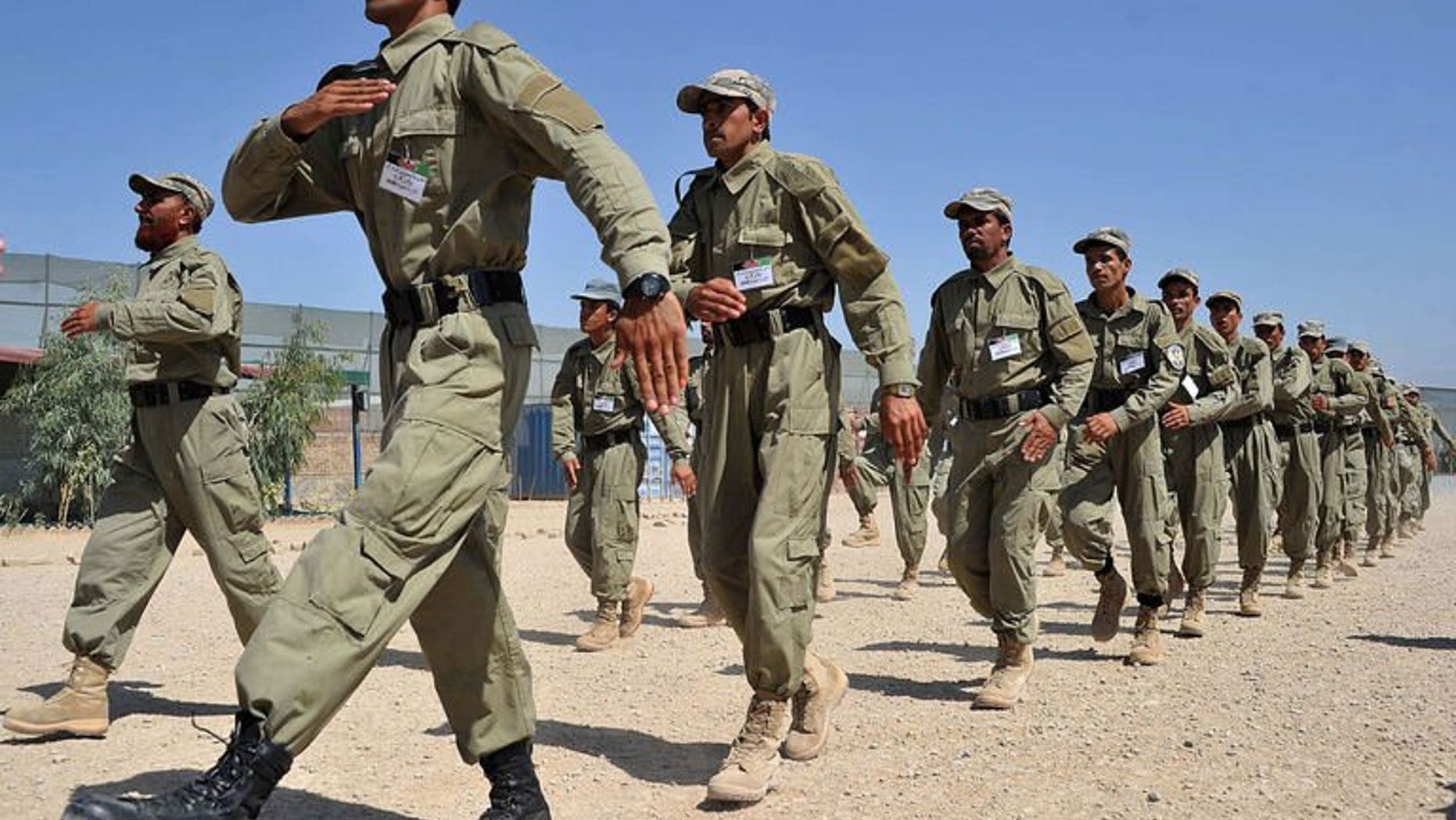 Afghan police march during a graduation ceremony at a police training centre on the outskirts of Jalalabad on July 4, 2013. A suicide bomber killed 12 policemen in the southern Afghan province of Uruzgan on Friday when he blew himself up inside a police station as officers ate lunch in a dining hall, officials said.
