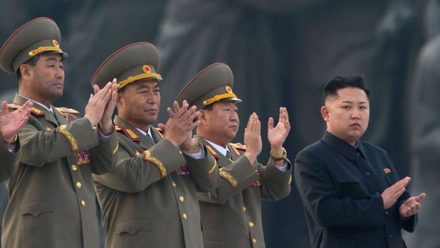North Korean leader Kim Jong-Un claps during the unveiling ceremony of two statues of former leaders Kim Il-Sung and Kim Jong-Il in Pyongyang on April 13, 2012. UN experts tasked with probing human rights violations in North Korea said Friday Pyongyang has refused to cooperate with the investigation, but that they still hoped to travel to the country next month.