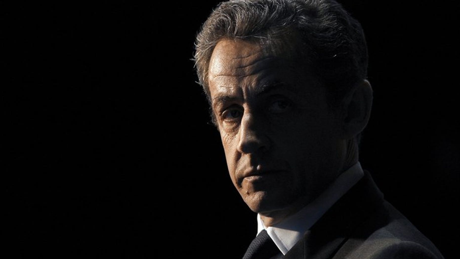 France???s then-president Nicolas Sarkozy waits to take part in a TV show in Paris on April 10, 2012. Sarkozy made a dramatic return to the French political scene on Friday, slamming a decision to deny his right-wing UMP party millions of euros in campaign reimbursements and issuing a call to arms to his supporters.