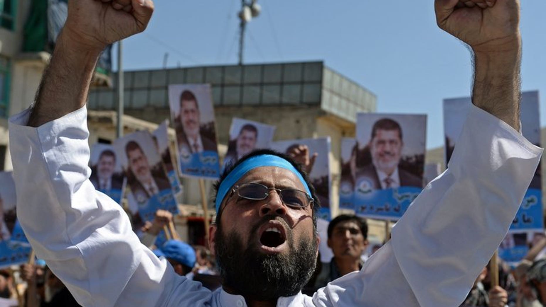 An Afghan demonstrator shouts slogans in support of ousted Egyptian president Mohamed Morsi in Kabul on July 5, 2013. More than 200 Afghans staged a noisy protest in Kabul on Friday in support of ousted Egyptian president Mohamed Morsi, whose Islamist regime was thrown from power after mass demonstrations and army intervention.