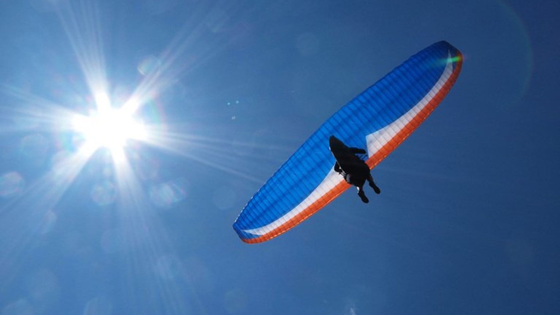 A paraglider flies near Chopok mountain in the Low Tatra mountains in Slovakia on July 10, 2010. Iran suspects them of spying, but friends of eight Slovak paragliders detained in May know them as freedom-loving adrenalin junkies who travel the world to film high-flying documentaries.