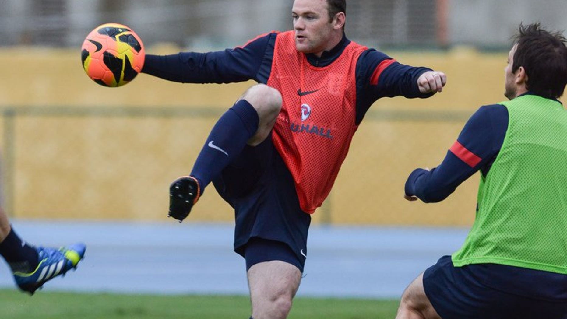 Wayne Rooney takes part in an England training sesssion in Rio de Janeiro, Brazil, on May 31. David Moyes used his first news conference as Manchester United manager on Friday to declare that striker Wayne Rooney was "not for sale".