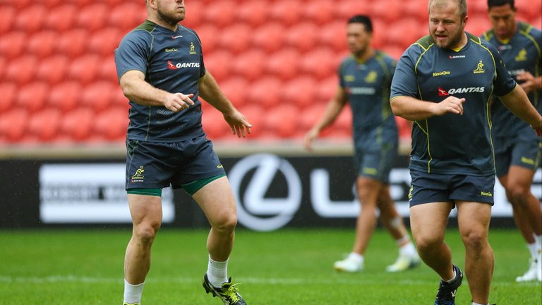 Australian rugby union players Stephen Moore (L) and Benn Robinson (R) take part in the captain's run at Suncorp Stadium in Brisbane on June 21, 2013. Moore on Friday said the referee and dominating the scrum held the key to victory in Saturday's series decider against the British and Irish Lions.