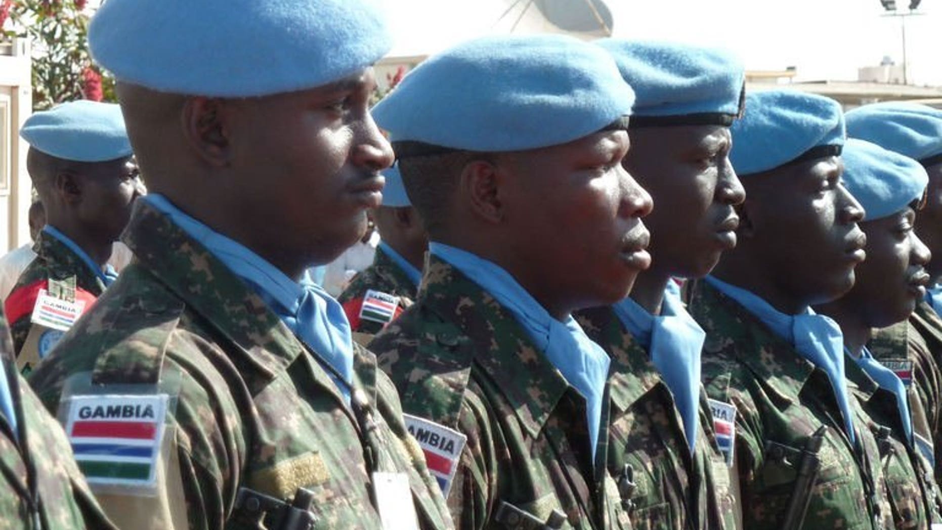 UN peacekeepers of the joint African Union-United Nations Mission in Darfur stand guard on January 16, 2012 in Darfur. Six UNAMID peacekeepers, five of them from Nigeria, have been killed in attacks in Darfur since last October. More than 40 peacekeepers have died in hostile action since the mission's establishment in 2007.