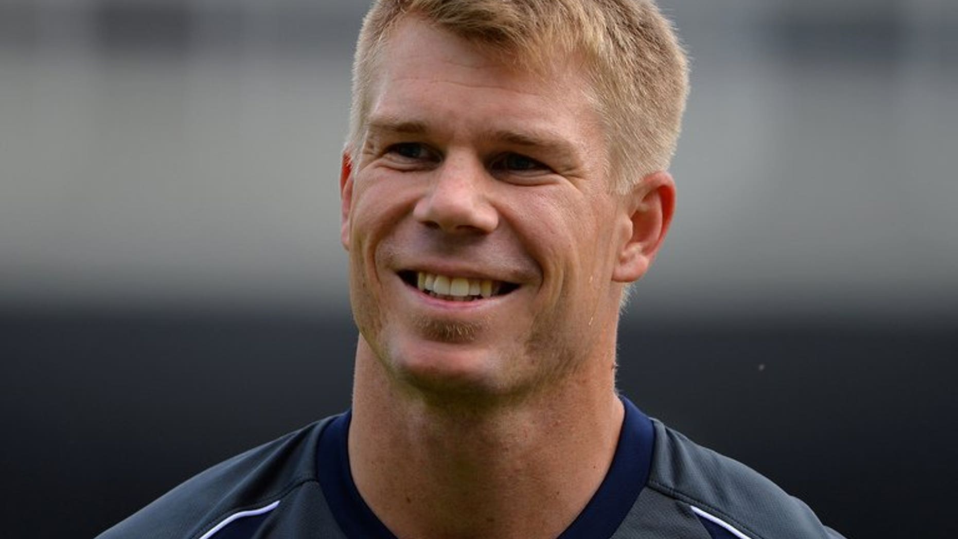 Australia's David Warner warms up in Birmingham, central England on June 12, 2013. Australia captain Michael Clarke said Friday that Warner could still feature in next week's first Test against England despite his recent ban.