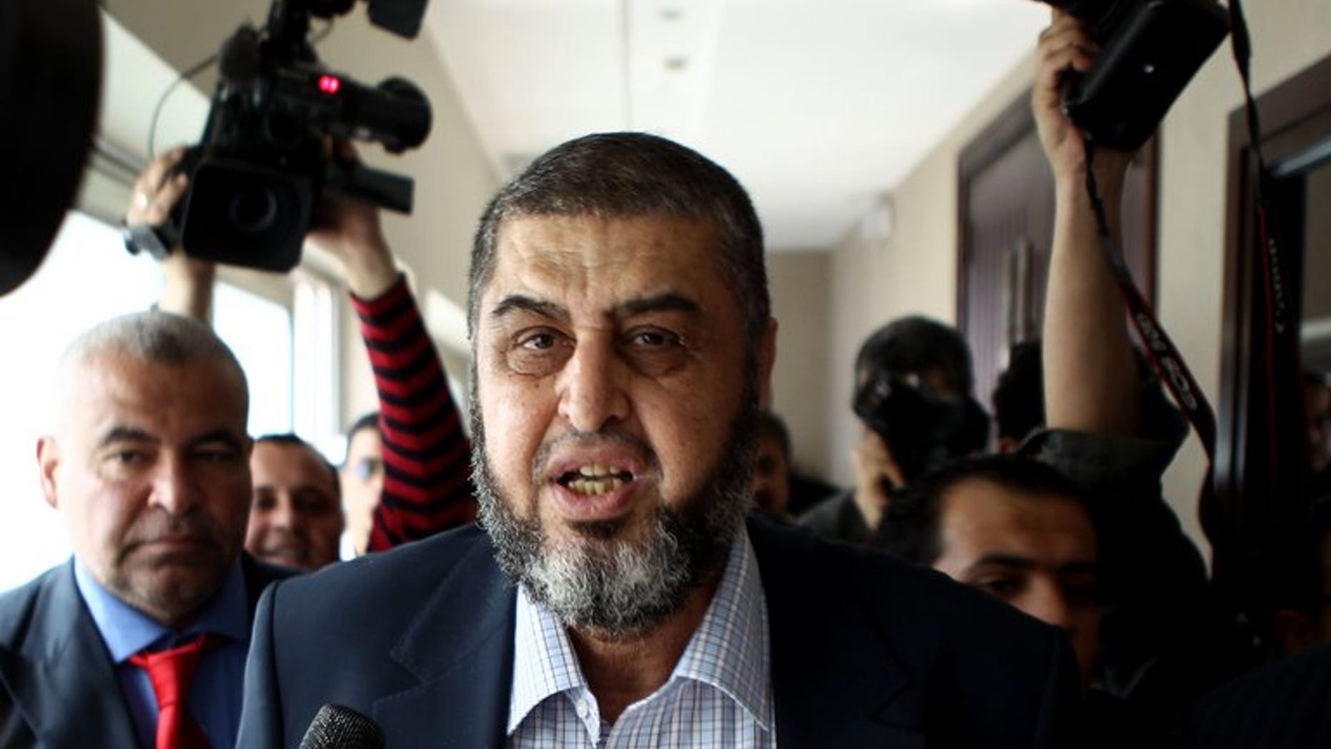 Khairat el-Shater leaves following a press conference in Cairo on April 9, 2012. Egyptian police arrested Shater, widely seen as the most influential Islamist politician behind deposed president Mohamed Morsi, an interior ministry general told AFP.