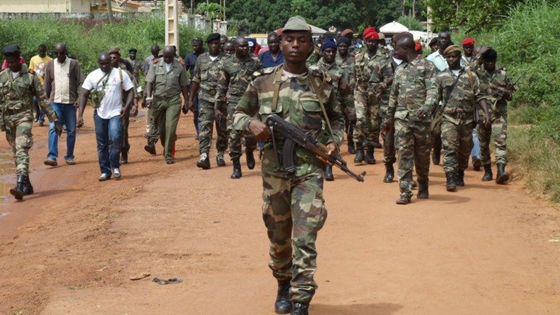 Guinea Bissau soldiers patrol in a street in Bissau last October. Guinea-Bissau opened a new presidential palace Saturday, paid for by China to the tune of $8 million.