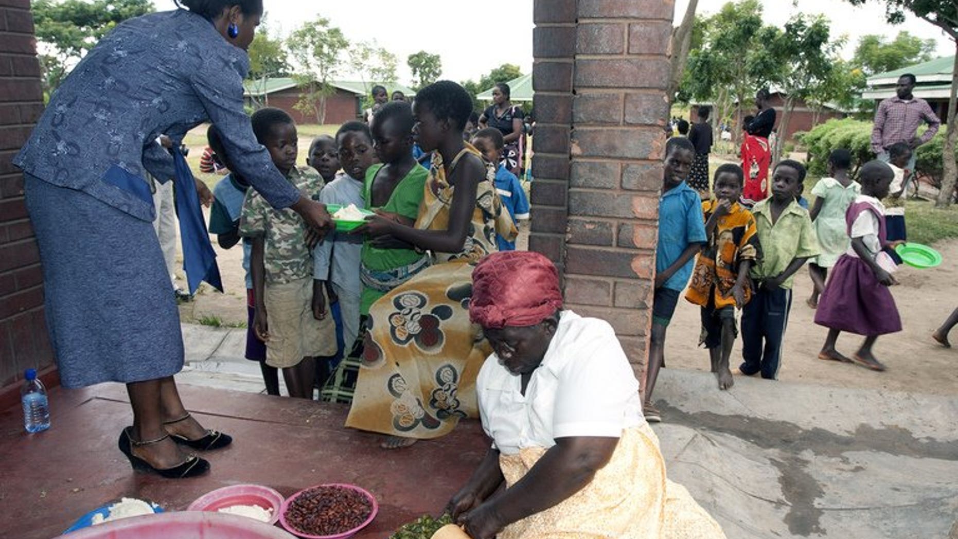 Children receive food at Mphandula Childcare Centre in Namitete on April 5, 2013. Malawi's runaway population growth has put pressure on scarce resources and so hampered development in the impoverished southern African nation, President Joyce Banda said Saturday.