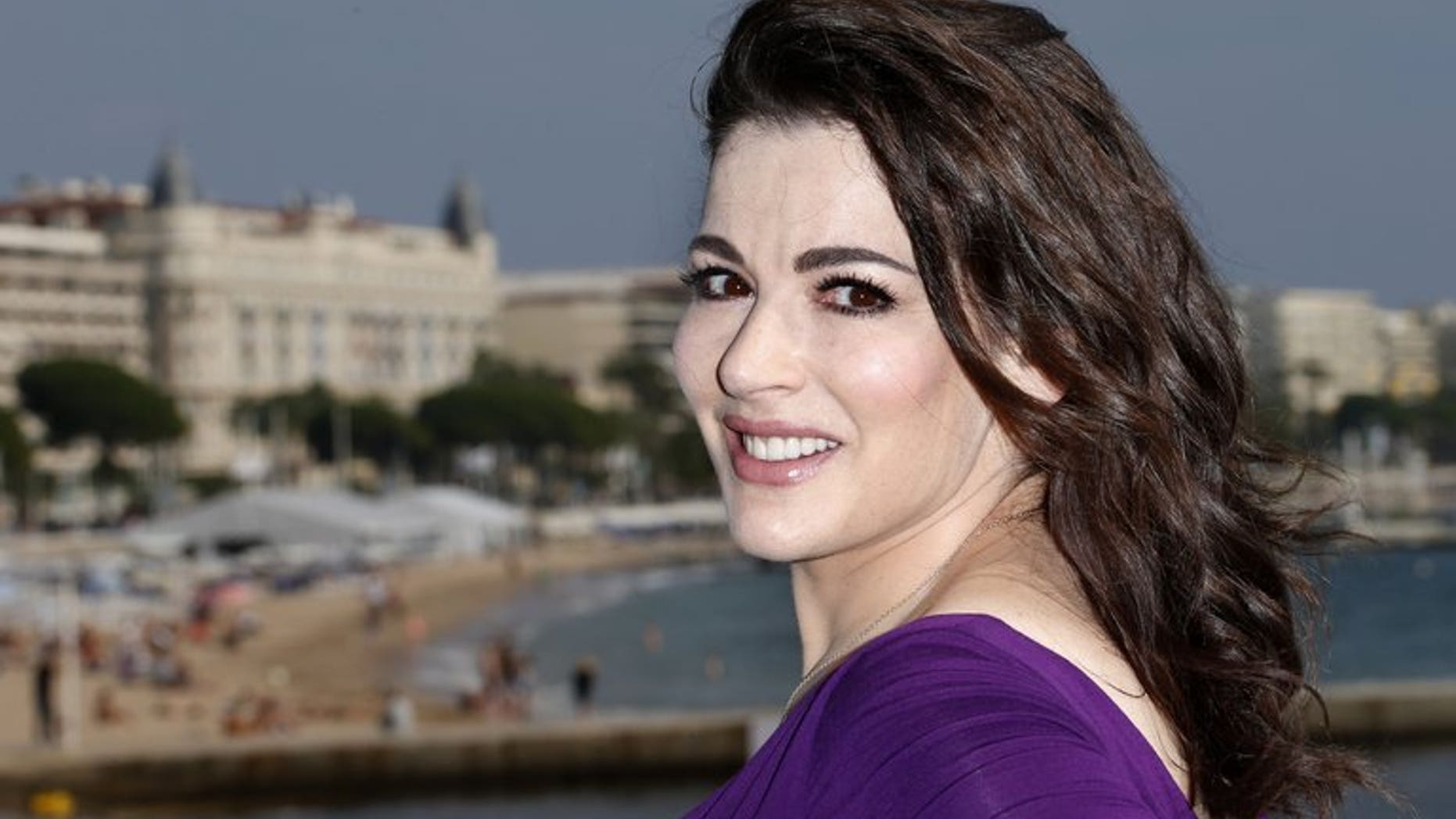 British art collector Charles Saatchi told a newspaper on Sunday that he is divorcing his wife, celebrity chef Nigella Lawson, pictured last year in Cannes, following an incident in which he grabbed her by the neck outside a London restaurant.