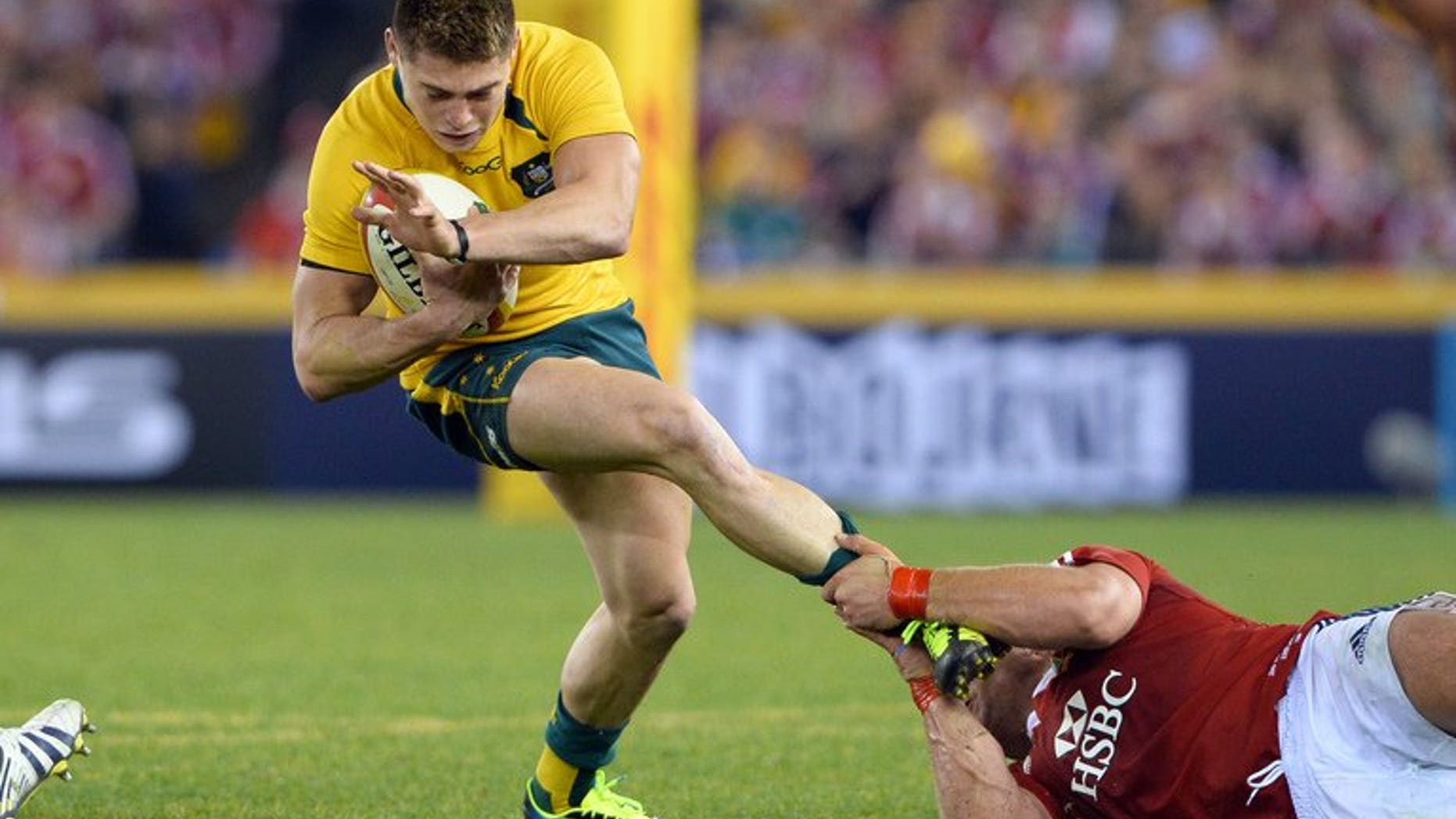 Australian Wallabies flyhalf James O'Connor (L) is tackled by a British and Irish Lions defender in the second Test match, in Melbourne, on June 29, 2013. The Melbourne Rebels have compounded O'Connor's woes at losing the deciding Test to the British and Irish Lions by confirming on Sunday they will not be offering him a further contract beyond the 2013 season.